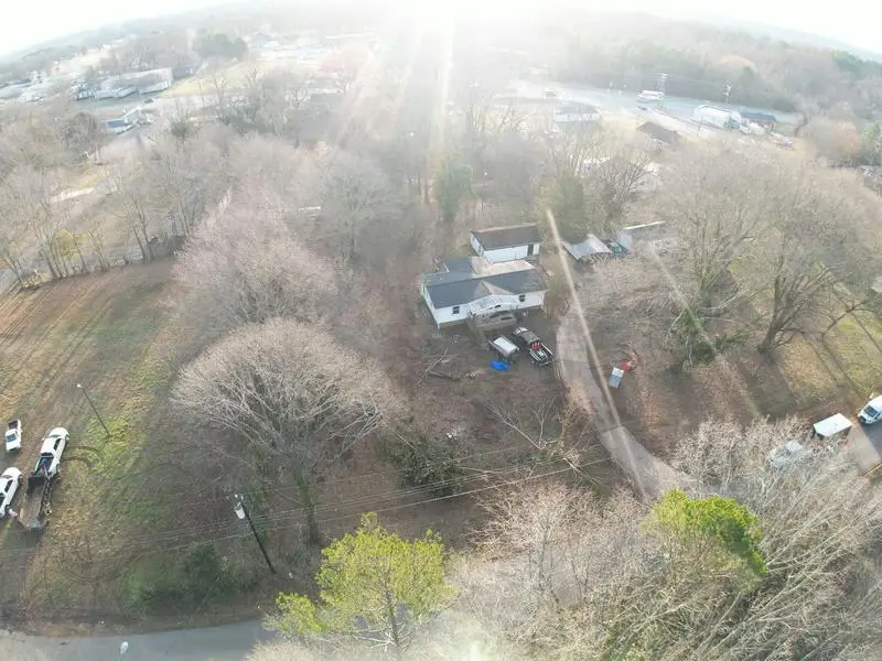 Aerial view of cleared land near a neighborhood
