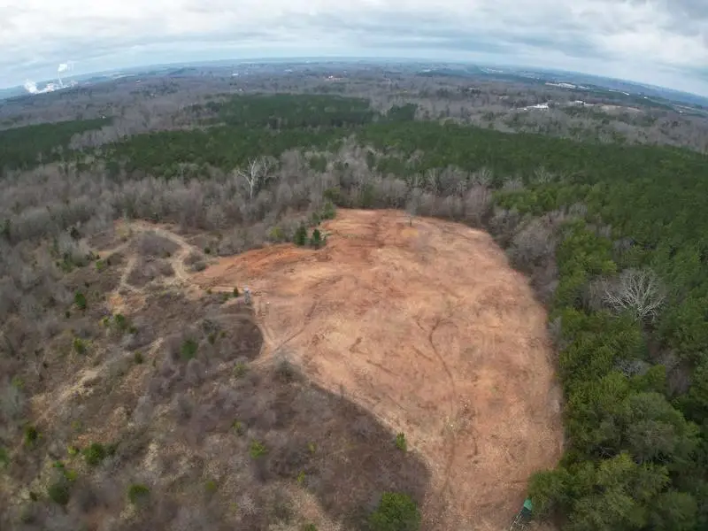 Aerial view of a large cleared tract in the treeline