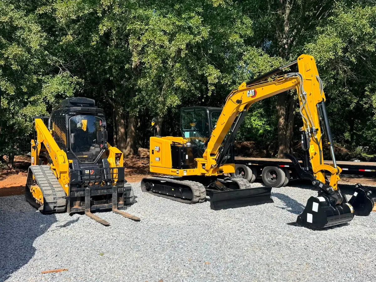 Land Pros skid steer with mulching head on a freshly cleared tract